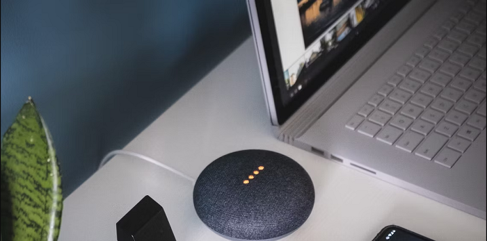 google home mini with laptop